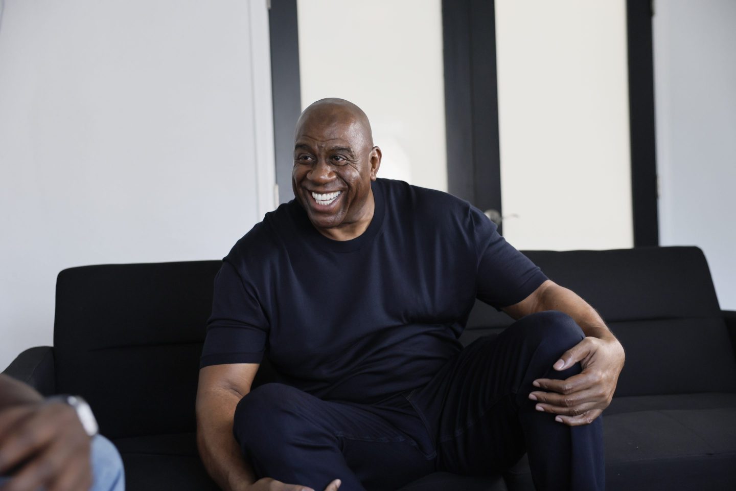 Los Angeles, CA - October 17: Lakers legend Earvin &quot;Magic&quot; Johnson talks to a Los Angeles Times reporter during an interview before he and GSK were joined by healthcare professionals and patient advocates to educate and raise awareness on the risk of Respiratory Syncytial Virus (RSV) infection for people 60 years of age and older at the Crenshaw Family YMCA in Los Angeles Tuesday, Oct. 17, 2023.  (Allen J. Schaben / Los Angeles Times via Getty Images)