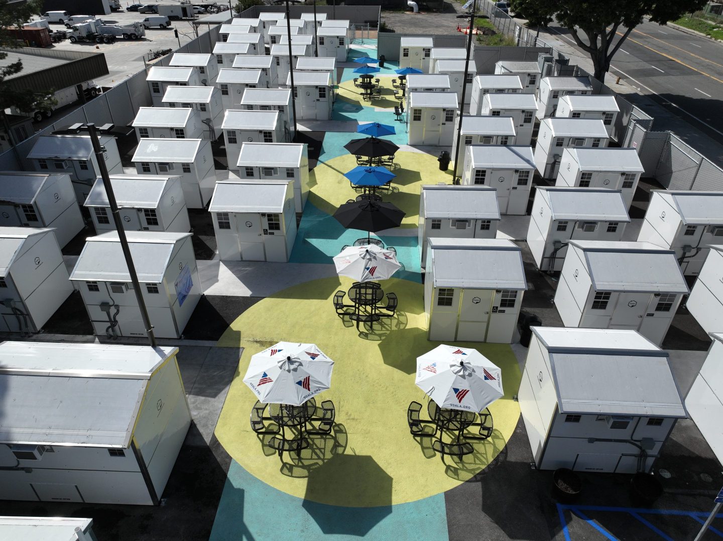 Boyle Heights, CA - February 08: Aerial view of the new Boyle Heights Tiny Home Village, following a ribbon-cutting ceremony by LA Councilman Kevin de León. The project sits on a city-owned lot and marks the third Tiny Home Village in Council District 14. A number of mariachis who became homeless because of the pandemic will be among those living at the village. Photo taken in Boyle Heights Thursday, Feb. 8, 2024.  (Allen J. Schaben / Los Angeles Times via Getty Images)
