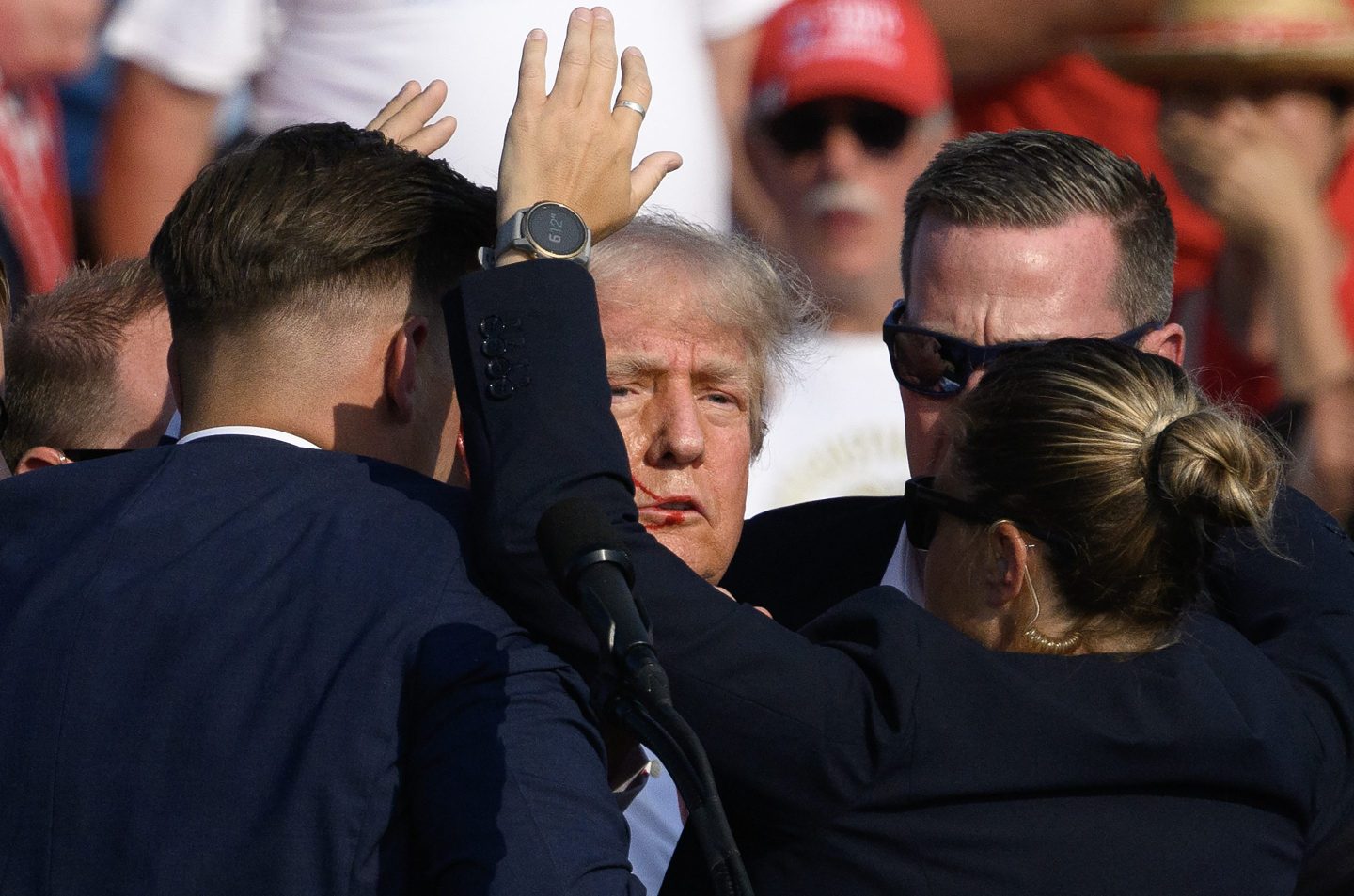 Secret Service agents surround Donald Trump