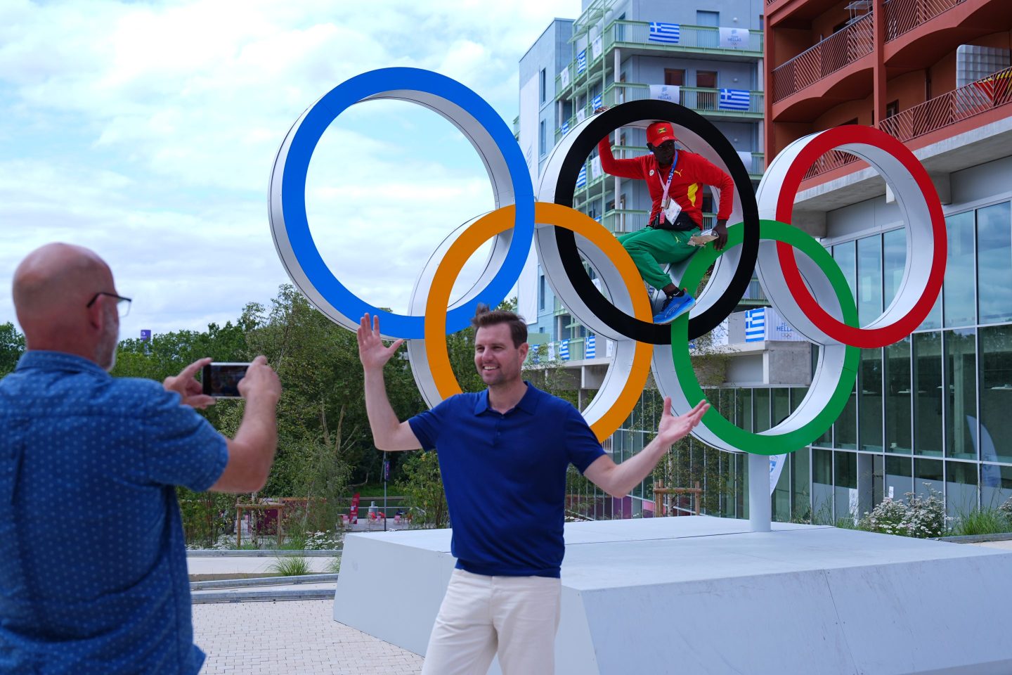 PARIS, FRANCE &#8211; JULY 23: An athlete poses for a photo with the Olympic rings in the Olympic Village during the media open day on July 23, 2024 in Paris, France. The Paris Olympics will be held from July 26 to August 11. (Photo by Zhao Wenyu/China News Service/VCG via Getty Images)