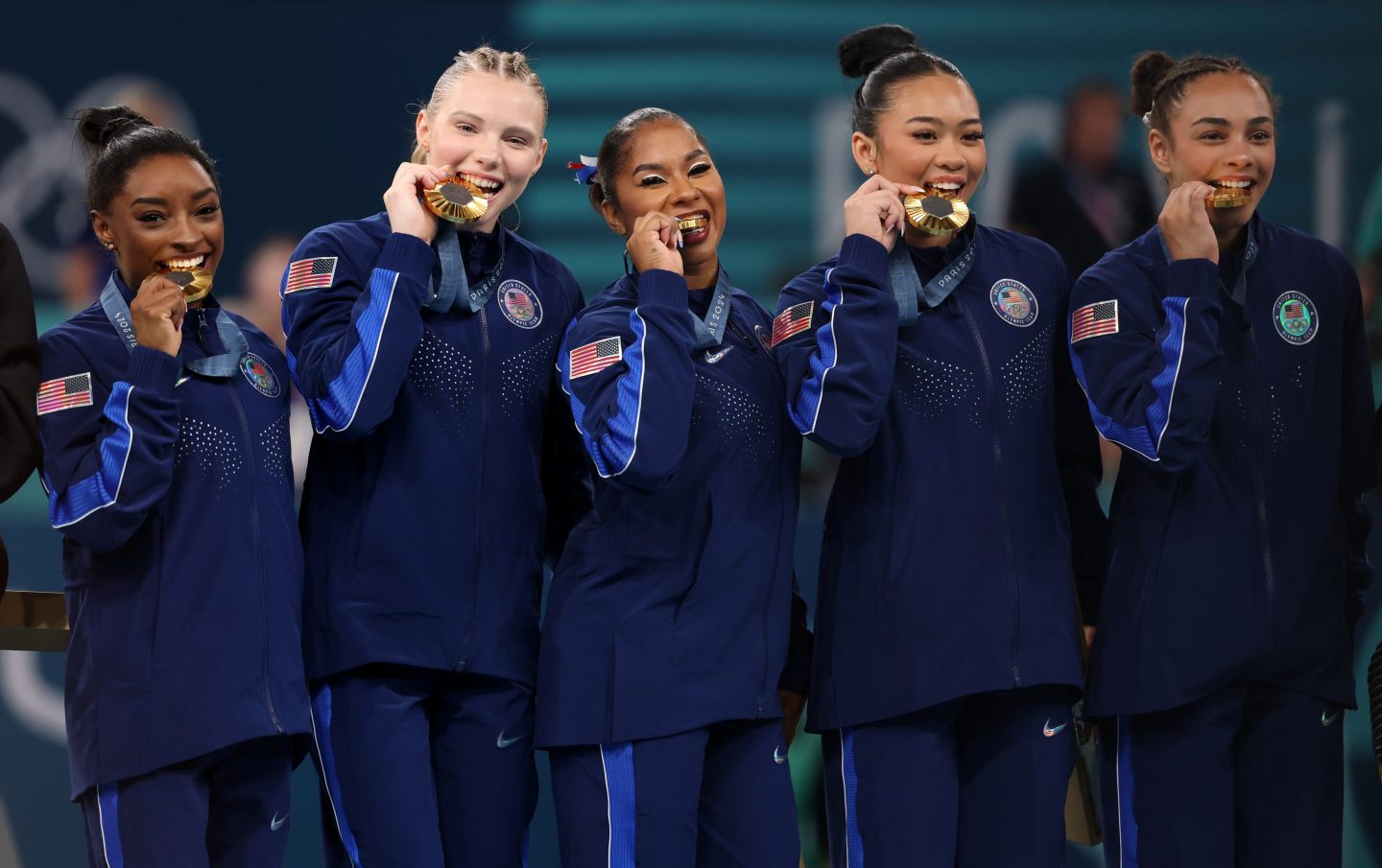 The United States team celebrates their gold medals on the podium during the medal ceremony for the Artistic Gymnastics Women's Team Final.