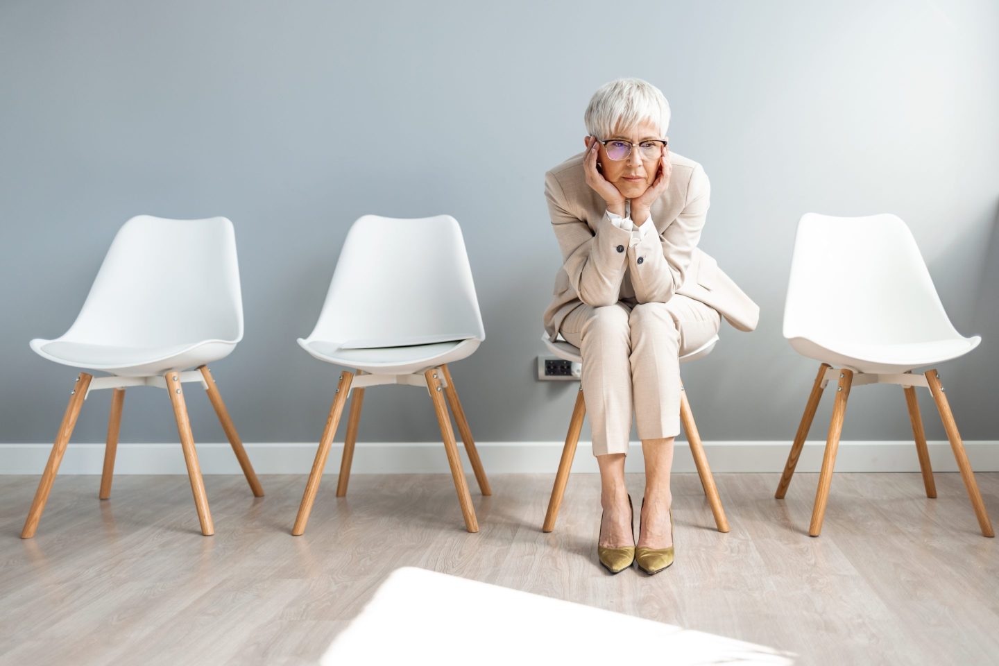 Businesswoman looks anxious as she waits for job interview.