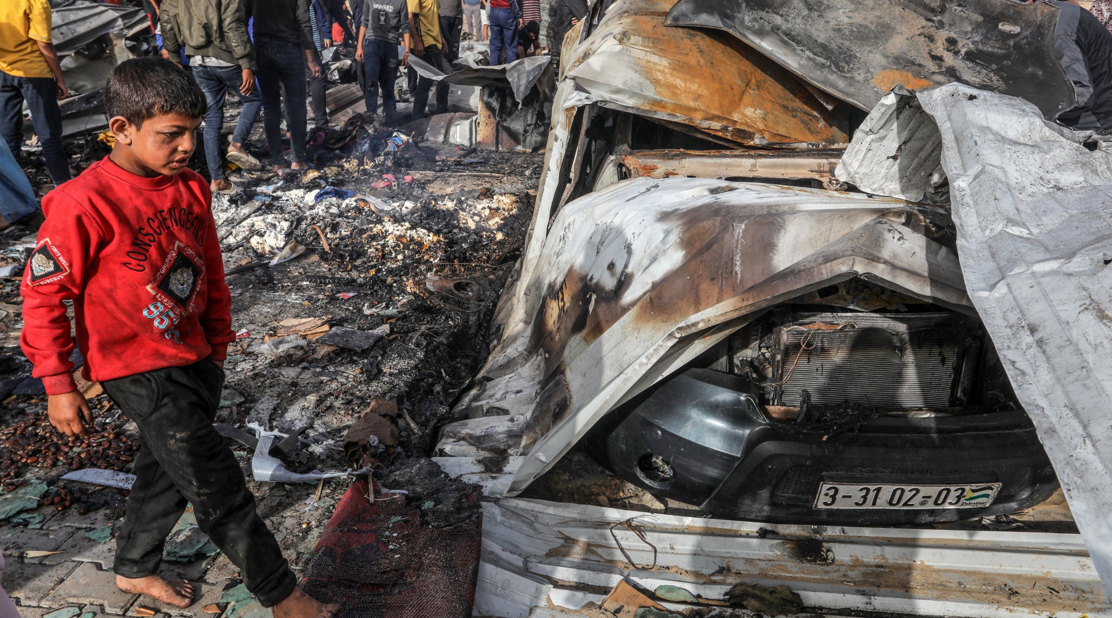 Palestinians inspect damage after an Israeli air strike, in the Al-Mawasi area, west of the city of Rafah in the southern Gaza Strip, May 27, 2024. (Abed Rahim Khatib/Flash90)