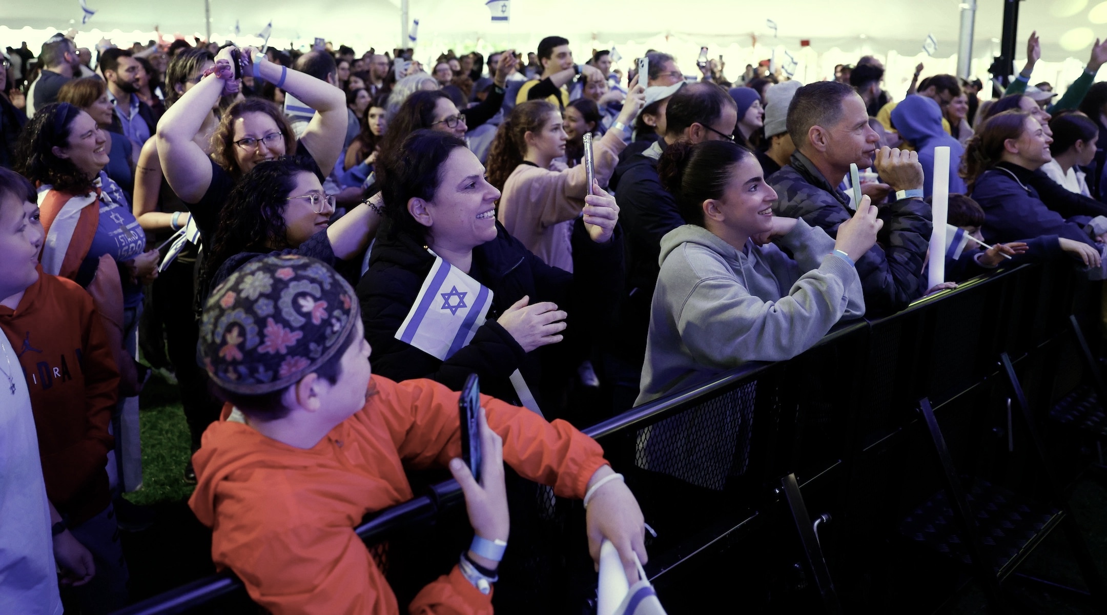 A crowd watches rapper Kosha Dillz perform during the “We Will Dance Again” event presented by MIT Hillel in Cambridge, Massachusetts, May 16, 2024. Hillels have come under fire from some campus encampments, which have demanded schools cut ties with them. (Danielle Parhizkaran/The Boston Globe via Getty Images)