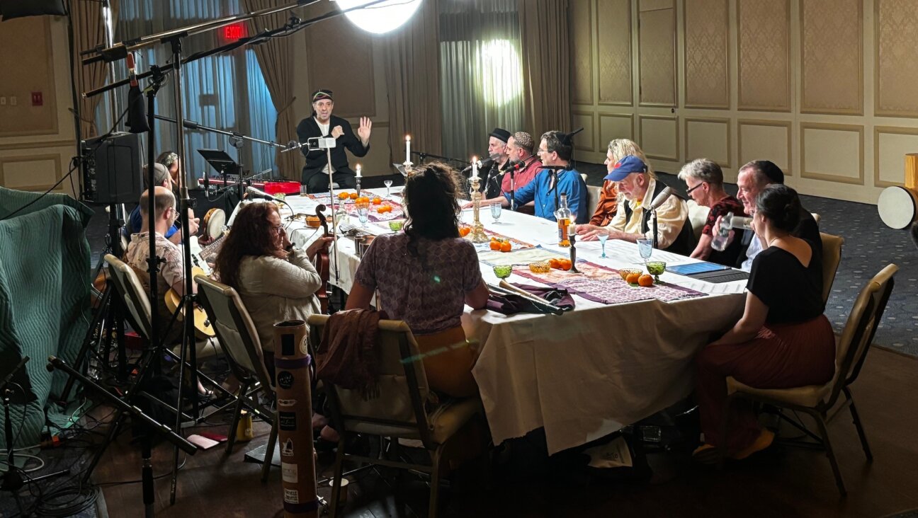 Frank London, standing, works with a team of musicians at Beth El Synagogue Center in New Rochelle, New York, May 22, 2024. (Aaron Bendich)