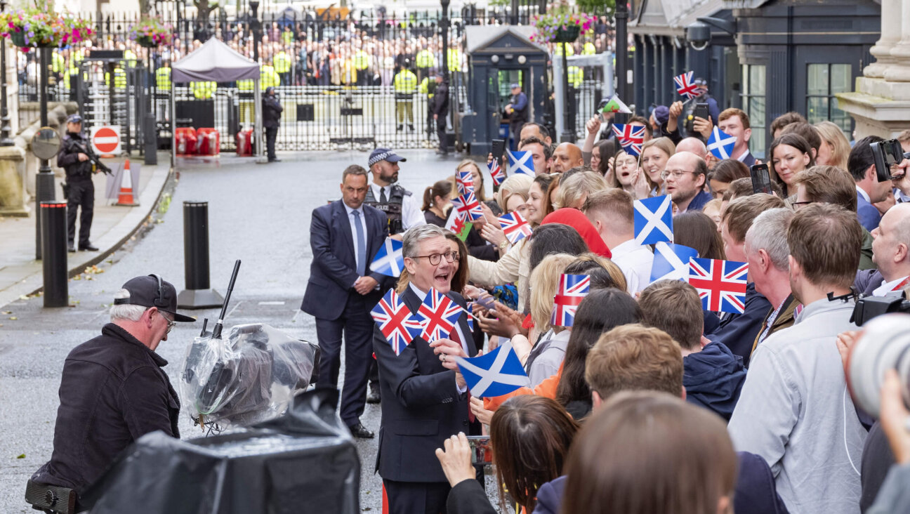 Newly elected UK Prime Minister Keir Starmer greets supporters at the prime minister's residence at 10 Downing Street in London. 