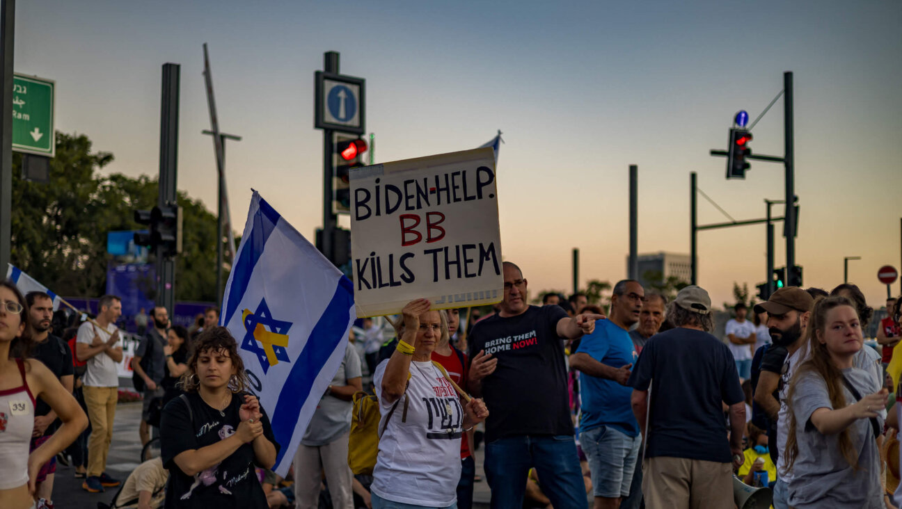 A protester holds a sign saying "Biden helps. BB kills them" at a Sept. 1 demonstration in Jerusalem for the release of the hostages, following the news of the murder of six hostages held by Hamas.