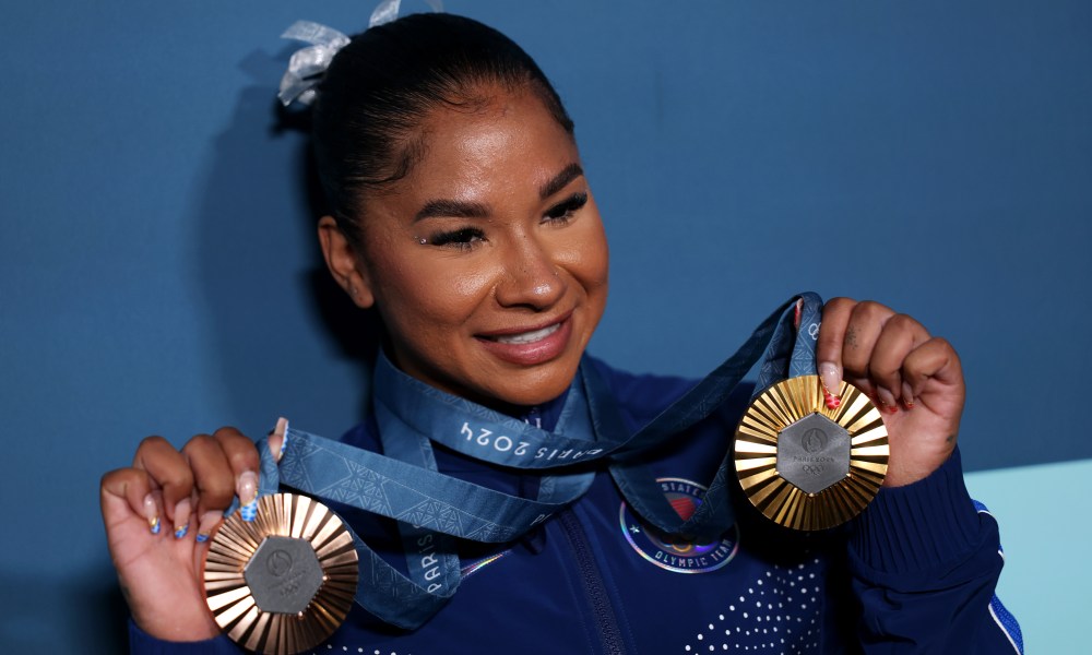 PARIS, FRANCE - AUGUST 05: Jordan Chiles of Team United States poses with her Paris 2024 Olympic medals following the Artistic Gymnastics Women's Floor Exercise Final on day ten of the Olympic Games Paris 2024 at Bercy Arena on August 05, 2024 in Paris, France. (Photo by Naomi Baker/Getty Images)