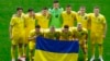 Ukrainian players pose with their flag before their match against Slovakia in Dusseldorf on June 21.