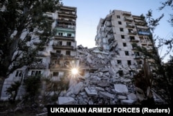 Heavily damaged residential buildings in the frontline town of Toretsk