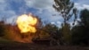 Ukrainian soldiers fire a 2s7 self-propelled howitzer at Russian positions along the front line in the eastern Donetsk region earlier this week.