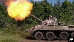 In this photo taken from video released by the Russian Defense Ministry on July 5, a Russian self-propelled mortar fires toward Ukrainian positions at an undisclosed location in Ukraine.
