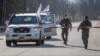 Vehicles of the OSCE Special Monitoring Mission to Ukraine in the Donetsk region in April 2020