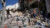 Palestinians inspect the destruction following an Israeli operation in Nur Shams refugee camp, near the West Bank town of Tulkarem, June 30, 2024. 