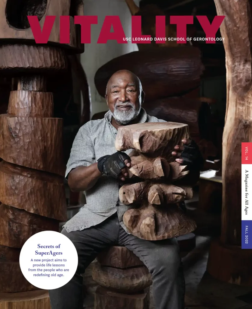 Vitality Magazine Fall 2022 cover, with Thad Mosley holding a wooden sculpture he's made. Header in circle says "Secrets of SuperAgers" with subheader "A new project aims to provide life lessons from the people who are redefining old age."