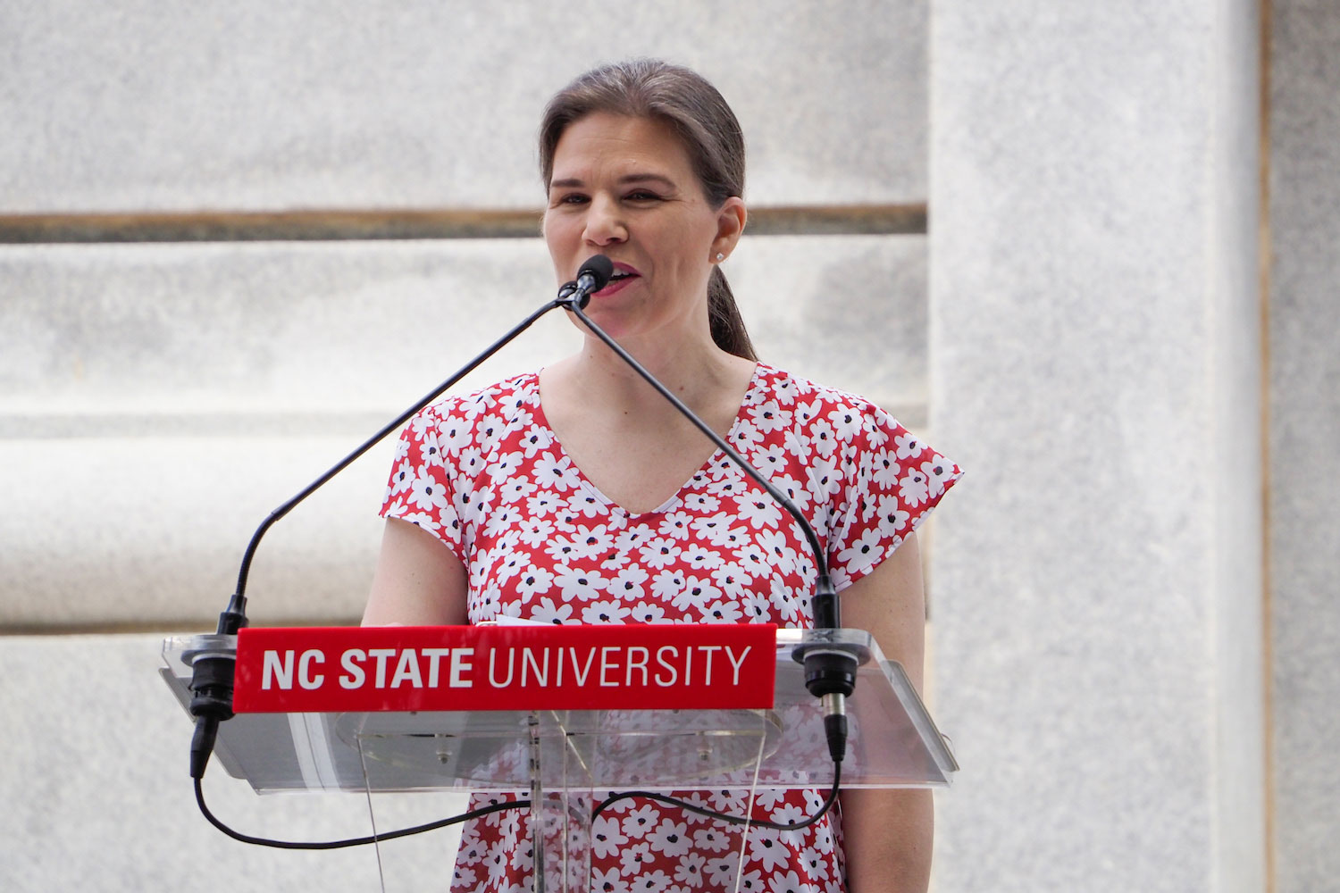 Class of 2022 Commander Michelle Parkington recounting the memorial aspects of the Memorial Belltower’s history.