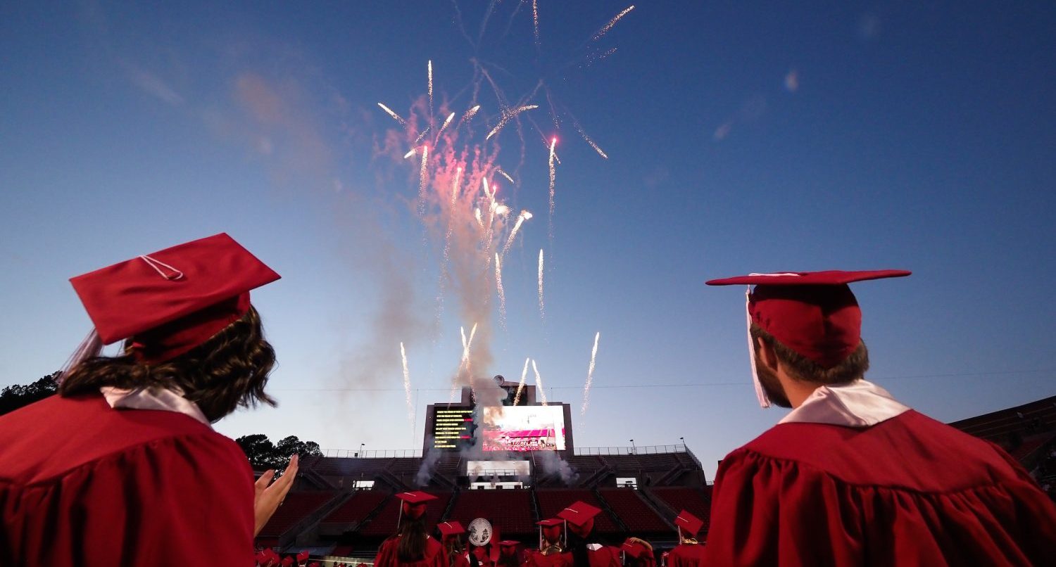 Fireworks lighting the night sky during graduation ceremonies at Carter Finley stadium.