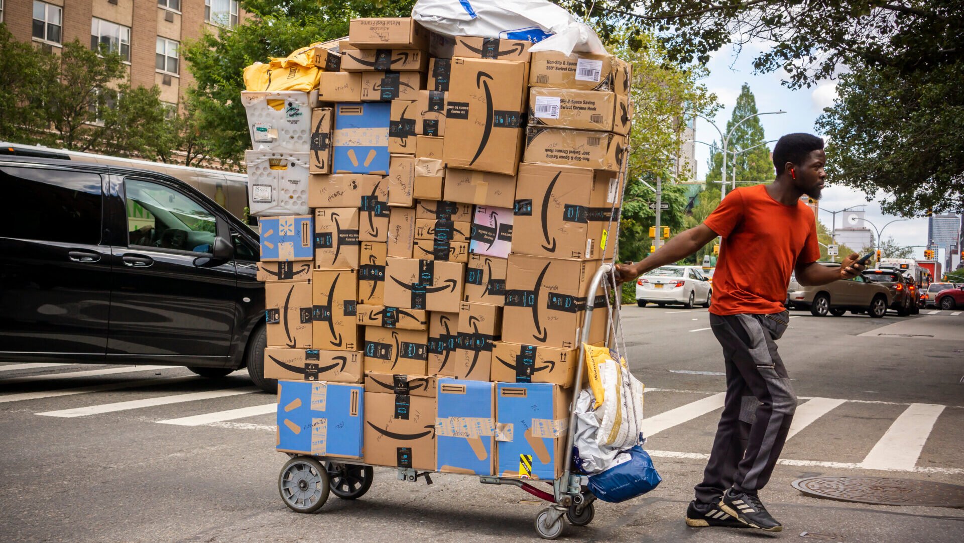 New York NY/USA-September 7, 2019 A handcart laden with deliveries, mostly Amazon, in the Soho neighborhood in New York