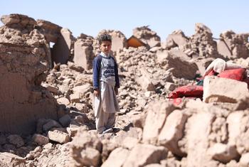 A child stands amidst the ruins left in the aftermath of the devastating October 2023 earthquakes in Herat, Afghanistan.