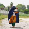 A mother receives her family's last food ration from WFP in Jalalabad, Afghanistan.