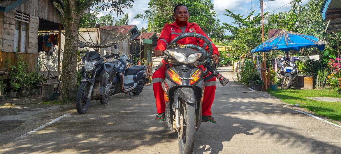 Volunteer firefighter Marlizar in Teluk Meranti Village, Riau.