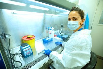 A research scientist in Georgia works on COVID-19-related experiments.