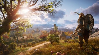 Captura de pantalla de Assassin's Creed Valhalla que muestra al personaje principal mirando un paisaje campestre