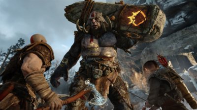 Screenshot von God of War, der Kratos, Adreus und einen Riesen zeigt.