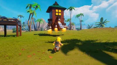 Capture d'écran de Lego Fortnite montrant un personnage LEGO courant vers une tour