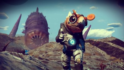 No Man's Sky-screenshot van een buitenaards personage met een zandworm op de achtergrond