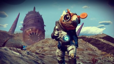 لقطة شاشة من لعبة No Man's Sky تعرض شخصية فضائية في المقدمة والوسط وديدان رمل في الخلف