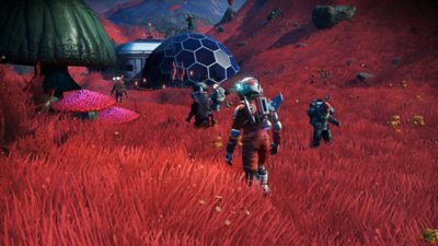 No Man's Sky-screenshot van een personage in een rood veld met een zeshoekige basis