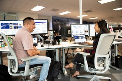 SIE employees working at a desk