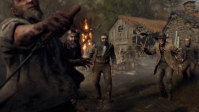 Resident Evil 4-screenshot van een meute moordlustige dorpsbewoners.
