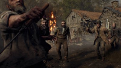 Resident Evil 4 – snímka obrazovky s davom vraždiacich dedinčanov.