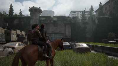 Екранна снимка на The Last of Us Part 2, показваща Ели и Джоел на кон в Сиатъл