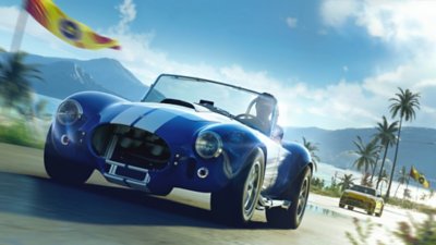 The Crew Motorfest-screenshot van een Shelby Cobra die racet over een weg met palmbomen.