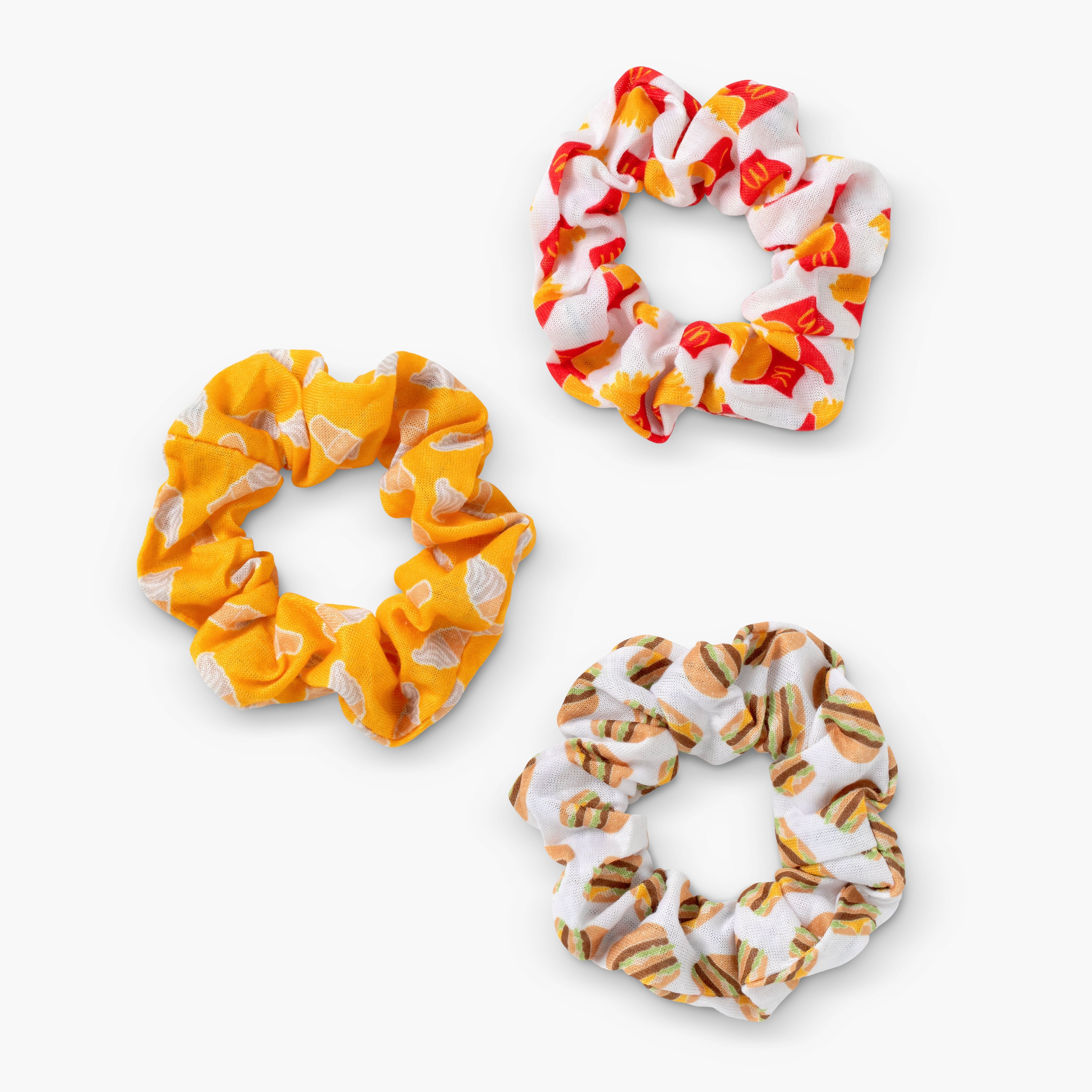 1 White and Red Fry Scrunchie, 1 Yellow Ice Cream Scrunchie, 1 White Big Mac Scrunchie.