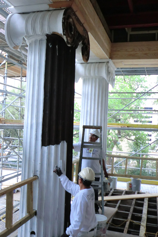 Workers Paint the Ionic Columns on the Front of the Mansion