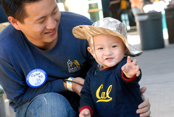 parent with child wearing Cal gear