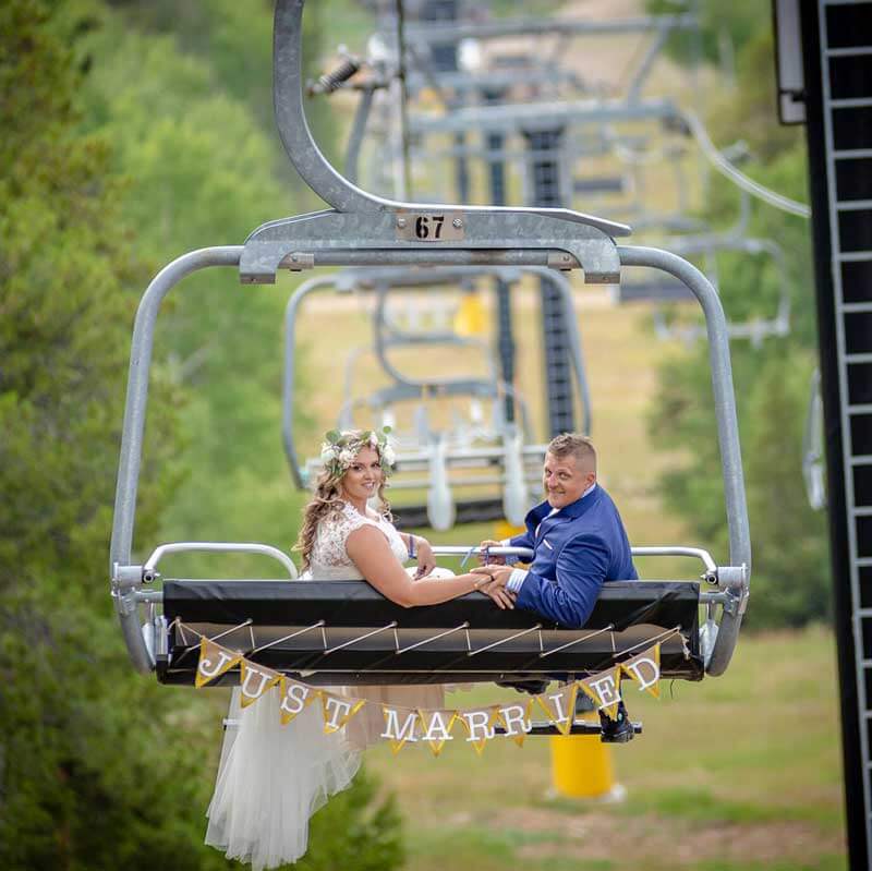 A newly married couple on a chairlift.