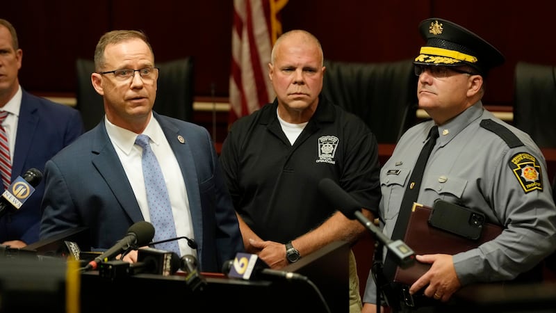 Kevin Rojek, left, FBI special agent in charge, Lt. Col. George Givens, center, Pennsylvania...