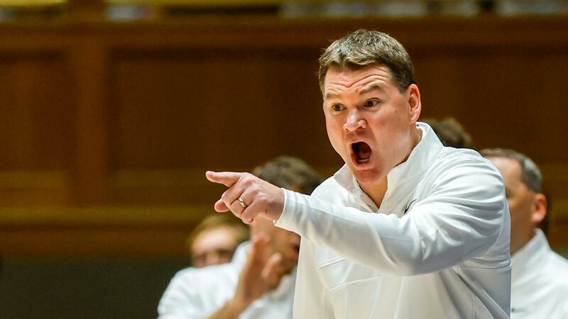 Arizona head coach Tommy Lloyd argues with an official during the second half of an NCAA...