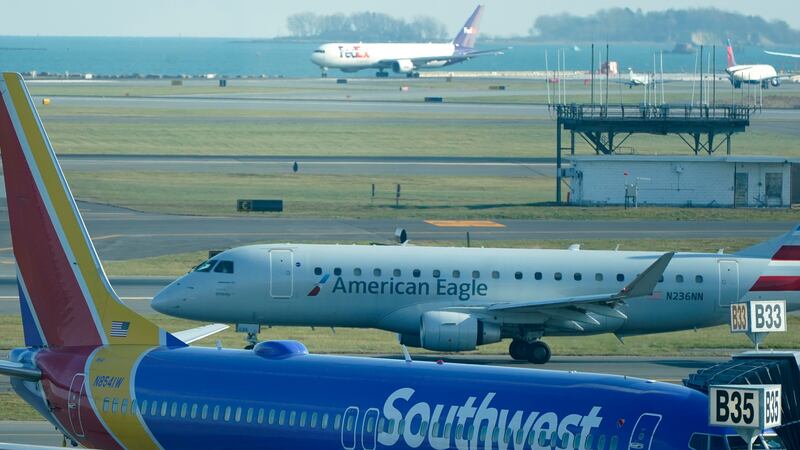 FILE - Southwest and American Eagle passengers jets on the tarmac the day before Thanksgiving,...