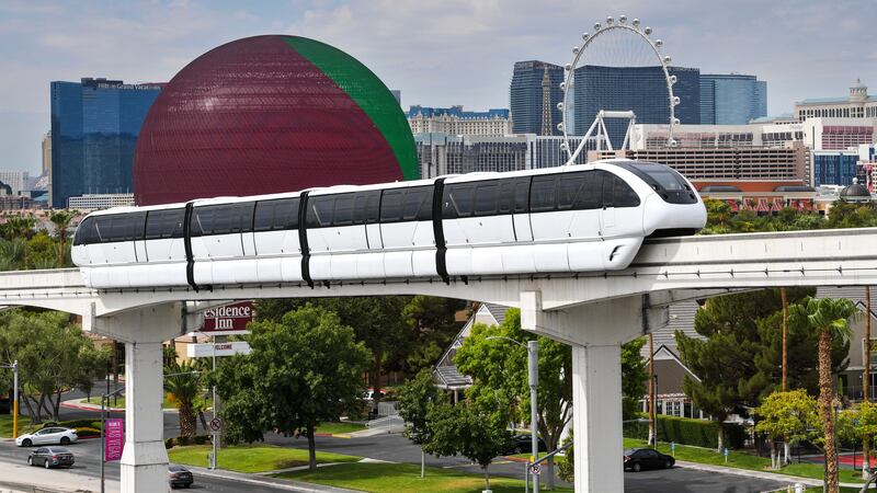 A Las Vegas Monorail train passes by the Las Vegas Convention Center Friday, August 18, 2023,...