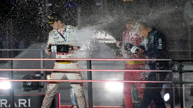 Red Bull driver Max Verstappen, of the Netherlands, left, Sergio Perez, of Mexico, center, and...