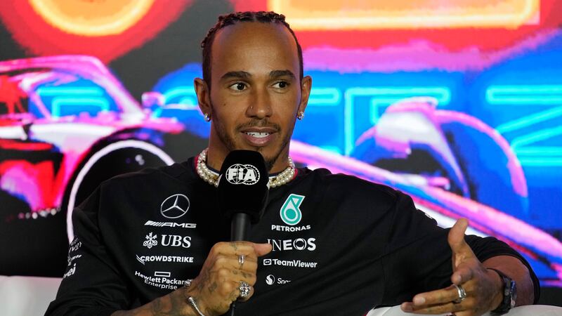 Mercedes driver Lewis Hamilton, of Britain, speaks during a news conference for the Formula...