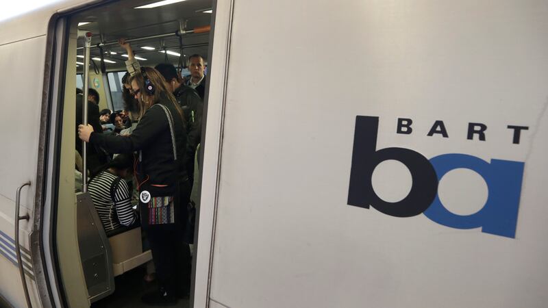 FILE - Bay Area Rapid Transit passengers wait for a BART train to depart, Oct. 22, 2013, in...