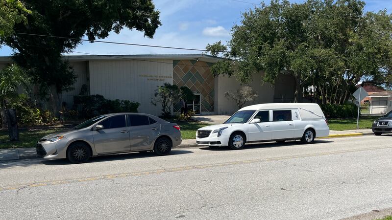 Mourners packed into the George Potter Building at the Sarasota County Fairgrounds Saturday...