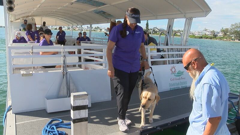 Instructor, Jennifer Johnson, trains guide dog, "Richard," walking him off the Gulf Islands...